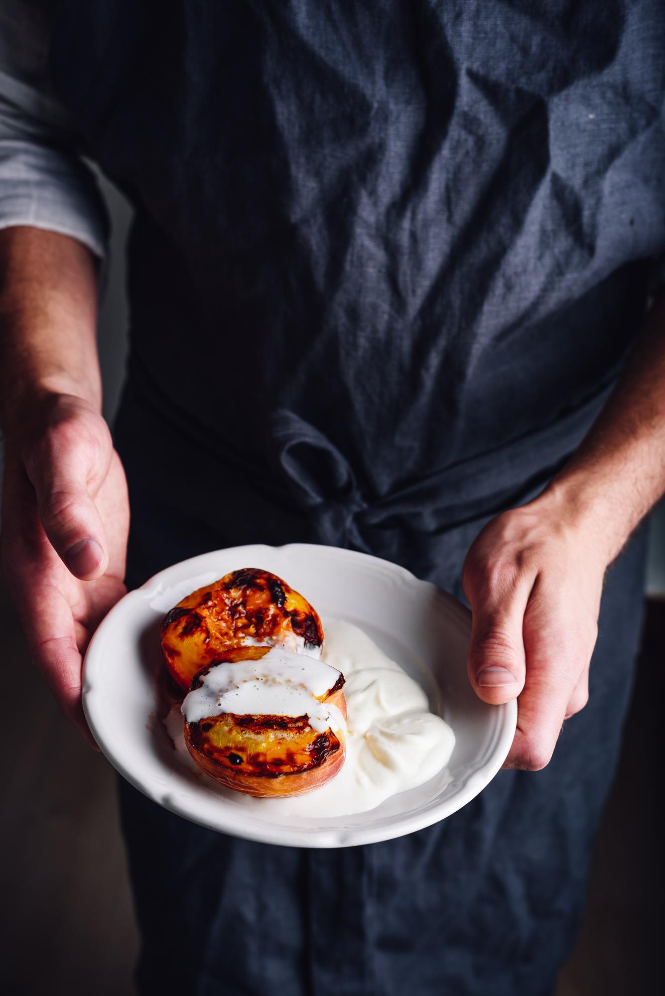 chef arranging a plated dessert in studio